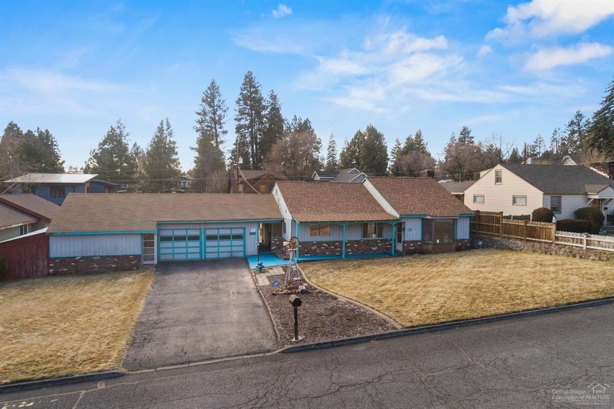 Location, Location, Location property like this rarely come available. This .28 acre flat lot sits across from Kingston Elementary School in the heart of Bend. This home offers the buyer either a quaint 1940's home with shop, garage and alley access or a developer with many development options. Underlying shop/garage and home sit on two .14 acres flat lots. Don't miss out on this amazing opportunity. Buyer to verify schools with new approved school boundary maps and development options.