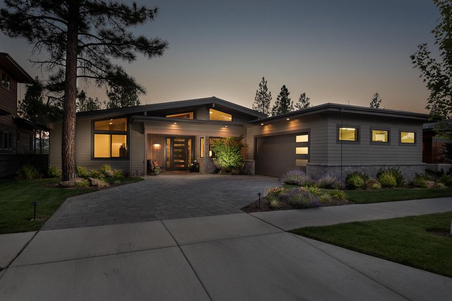 Amazing single level custom home built by Rundle Construction located in NW Bend! Spacious modern layout with beamed vaulted ceiling plus wall of windows leading out to paver patio with gas fireplace and TV. Kitchen is fully equipped with Thermador appliances, custom cabinets, built-in refrigerator and wine cooler, large island with quartz countertops. Butler pantry with dishwasher, refrigerator and prep space for entertaining. Primary suite has beamed vaulted ceiling, fireplace and separation for privacy. Primary bath with a soaking tub, curbless walk-in shower, skylights and large walk-in closet with built-ins. Guest suite features full bath, tile shower, walk-in closet and built-ins. Third bedroom has vaulted ceiling with access to full bath with tub/shower combo. Large office with vaulted ceiling, spacious mudroom and dedicated laundry room. Well appointed home with many upgraded features. Conveniently located near Shevlin Park, trails, restaurants, shopping and downtown.