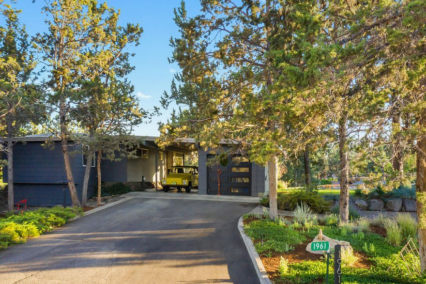 One-of-a-kind mid-century modern w/ active short term rental (STR) permit! Furnished, turn key investment opportunity in a growing vacation market. Large .37 acre lot w/ plenty of parking, including RV. Elevated location allows for privacy, peace & quiet. Wraparound deck, w/ access from both sides, is ideal for indoor/outdoor living. Low-maintenance yard w/ multiple entertaining spaces & two outdoor fire pits. Big picture windows & custom white cabinetry make the interior living space light & bright. Beautifully updated bathroom features white cabinets, walk-in shower & custom fir countertops. Ceiling fans, insulated 2-way blinds & cast iron gas stove contribute to affordable utilities. New siding, exterior paint & garage door add to the clean 60s-modern style. Easy access to Larkspur Trail, skate park & new Athletic Club/Senior Center. Convenient to shopping & restaurants. Located w/in desirable Bear Creek Elementary & Bend High School boundaries. Ready to enjoy or rent!