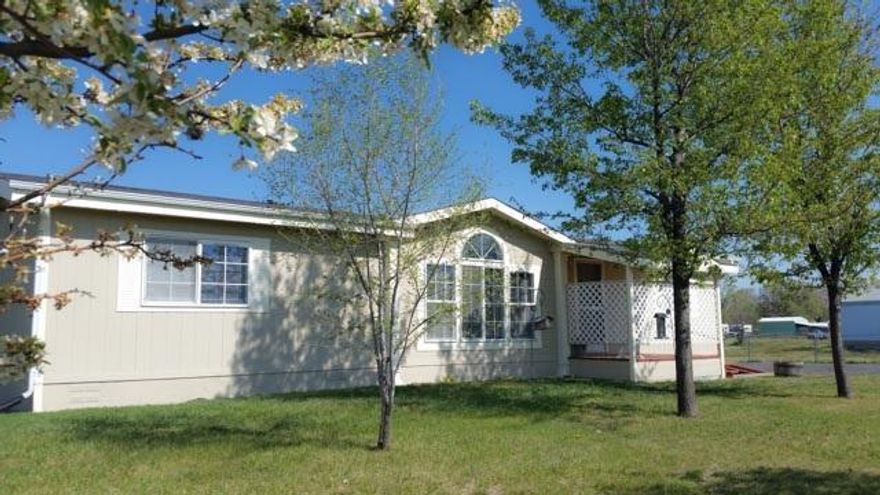 Very Nice Double-wide In Excellent Condition Located Within Walking Distance To Wal-mart & Shopping Yet Along A Quiet Street With Minimal Traffic. Large Fully Fenced Yard. Private Well. Big Bedrooms, Vaulted Ceiling, Large Living Room, Air Conditioning & Brand New Flooring & Paint. Move-in Ready And Clear Pest/Dry Rot Report. Nice Yard & Utility Sheds For Extra Storage & Plenty Of Room To Park Rv's, Autos, Or Boats - All Within An Enclosed Fenced Area. A Must See!Water Supply Is A Private Well Located On The Property. All State-required Well Tests Are Completed. Water Filtration System In Place. Shared Driveway. Private Well Or Kid Irrigation From The Ditch For Low-cost Yard Watering & No City Water Bills! Clear Pest/Dry Rot Report On File. This Home Is Ready To Close!