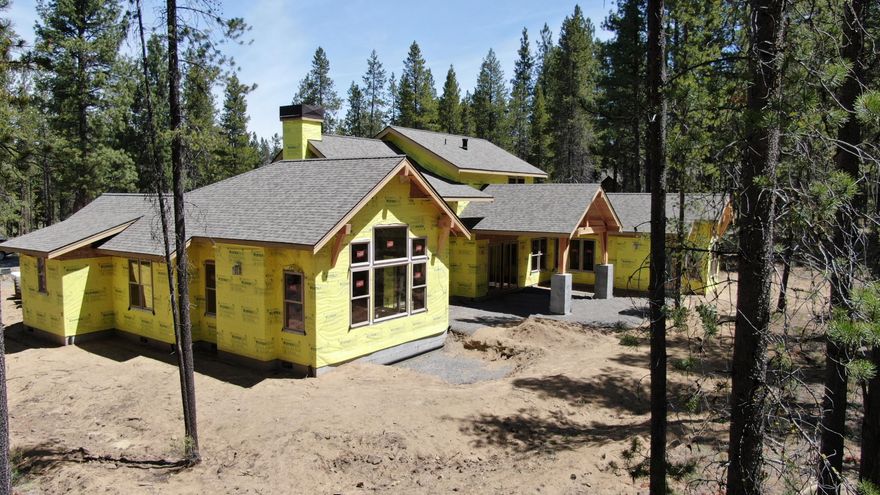 Slated to be completed in Fall 2020, this custom NW style home offers ample gathering spaces perfect for large families, reunions, retreats, and special get-a-ways. There are three master suites on the main level along with great room, gourmet kitchen, dining room, office, bunk/media/recreation room, laundry/mudroom, and an expansive covered paver patio with hot tub for relaxing or entertaining with views towards the forest. Upstairs find three more suites. Features include distress wood beams, custom cabinetry, rich woods, solid surfaces, designer tile, high-end appliances, built-in fridge, and wi-fi enabled two zoned Central A/C. Contact your agent to preview today.