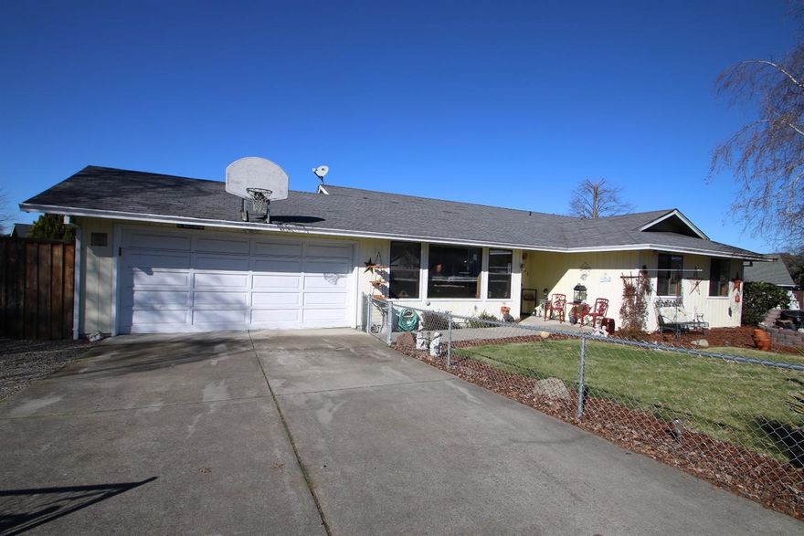 Simply charming! This 3 bedroom, 2 bath home is complete with a garage, shed, play house, covered patio/deck, and spacious dog kennel. PLUS cozy gas fireplace and sunny windows with views of Roxy-Ann! The master suite also has a full bath and walk-in closet. Great price, great location, and complete with a fully fenced nearly quarter-acre lot!