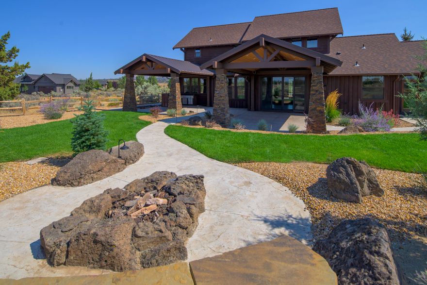 Commanding Mountain Views and a NEW kitchen greet you as you enter this warm and well appointed home in Prestigious Brasada Ranch. Inviting and open, with granite countertops, walnut  finishes, boasting hardwood floors in the great room, accented by a stacked stoned, gas fireplace, many built-in features and the Cascade Mountain View backdrop. In addition to the new kitchen appliance package, this home is excellent for entertaining. With main level living that includes two Bedrooms downstairs, The Primary Bedroom and an additional guest room or den/office, this Great room design offers spacious living and dining options, as the floor plan is as functional as it is desirable.  The upstairs family/bonus room, two guest rooms, and bathroom offers the perfect private spaces for all, with under-stair storage and a finished triple car garage. Step out back, to discover the peace and beauty of Central Oregon with TWO covered  patios, an inviting fire circle, and newly fenced yard.