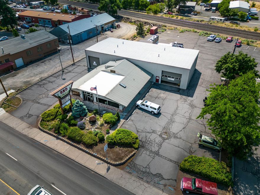 Consider this investment or owner/user opportunity centrally located on NE 3rd Street in Bend.  The building is 8,298 sf with 2,798 sf of offices and retail space that was originally a restaurant, and the remaining 5,500 sf is steel framed, high ceiling, clear span shop space with four large roll up doors.  The site is in an excellent location with great visibility and easy access.  The site consists of 0.94 acres zoned CG (General Commercial) including a vacant lot so parking is abundant.  Neighbors include McDonalds, Albertsons, Kendall Ford, Boot Barn, Carl's Jr., Rite Aid and others.