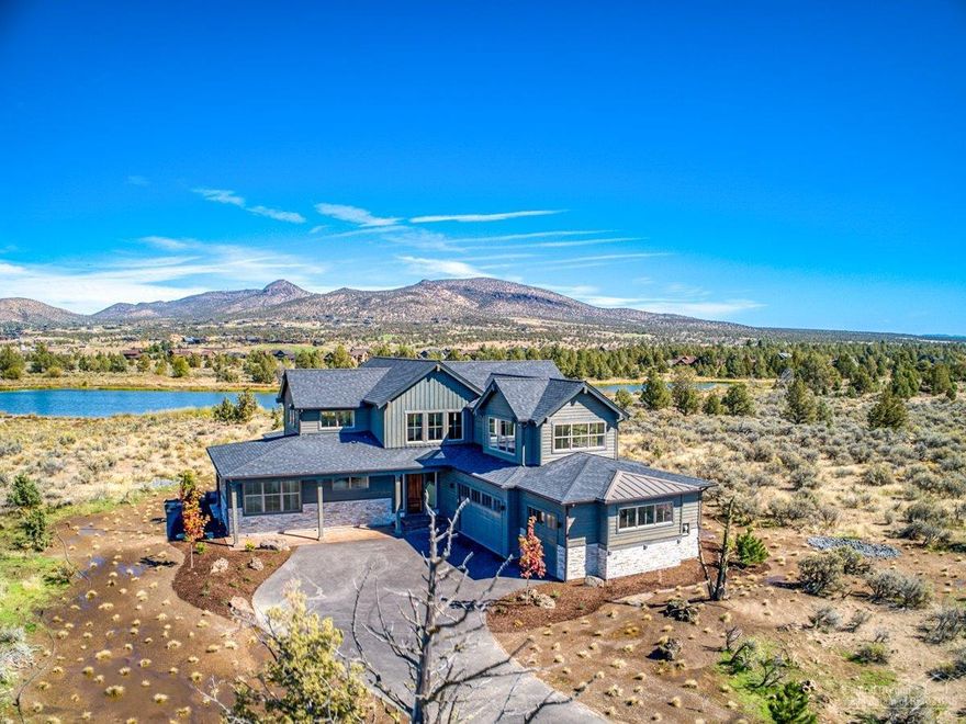 Beautiful Ranch Style Home on the Lake with Amazing Lake and Cascade Mt Views in the Gated Community of Brasada Ranch, Exterior Stone Accents, Two Story, Very High Ceilings open to upstairs, Hardwood Floors, Stone Fireplace with Built Ins, Large Slab Island in Kitchen with Huge Corner Pantry, Master Bedroom Suite with Elegant Tiled Master Bath and Walk-In Closet, main floor has a Den/4th Bedroom, Upstairs has Two Bedrooms, Bath and a Spacious Bonus Room, Triple Finished Garage, Mountain or Lake Views from almost every room in this house. Lake has Floating Dock and Fish. Close to the Equestrian Center and Miles of Hiking and Biking on BLM Land. Enjoy all the Benefits of Membership, Athletic Center with 3 Pools, Water Slide and Lazy River, Adult Only Pool (coming soon), Equestrian Center, 18 Hole Golf Course, Member Club Room, Spa Brasada, Restaurants, Hiking, Biking, Horseback Riding and much more!