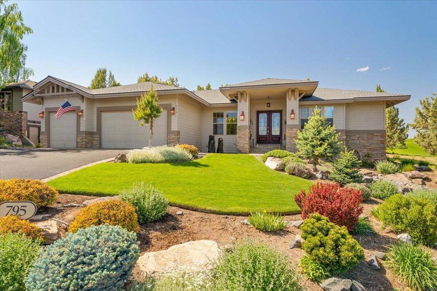 Gorgeous remodeled single-level on the 10th fairway of The Challenge Course in The Falls 55+ at Eagle Crest Resort! The great room features soaring vaulted ceilings, a wall of windows, new solid hickory floors, stacked stone fireplace, and built-ins. The kitchen is a chef's dream with double islands, Thermador appliances, propane cooktop, slab granite counters, a dry bar boasting a natural wood countertop with a live edge, Sub-Zero wine cooler, and KitchenAid ice maker. The Z-Tech deck is equipped with an electric awning, a plumbed propane fire pit and overlooks the peaceful waterfall and the fairway beyond. The renovated primary bath has a solid quartz dual-sink vanity, dressing table, accessible walk-in shower with dual shower heads, spacious walk-in closet, and separate water closet. An office, laundry room, two guest bedrooms with adjacent full bath, a half bath for guests, and a triple car garage with built-in overhead storage completes this amazing home!