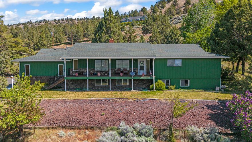 This 4-bedroom 3-bath home, 4,320 sf sits on 8.76 Acres with beautiful views. Home offers attached 2 car garages plus detached shop w/concrete floor 12' and 10' roll up doors. Paved driveway from street to home. The roof was replaced in 2009 with 40 yr roof. The front door opens into a large living room with valley views and heated with pellet stove. Kitchen has granite counter tops installed in 2014. Home has central vac, large walk-in closets. Downstairs offers a large family room, large wood stove, a large utility room, large pantry, Office space, sewing room, hobby room, laundry room.