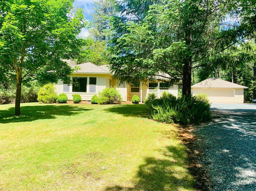 Privacy and Peace! 1 mile off of I-5 Exit 66 In a highly sought after neighborhood. This is a Lovely 2 bed 1 1/2 bath home. Nestled on beautiful and private flat wooded 2.5 acres! Adjoining home also available for possible two family set up. This home has a detached two car garage with automatic door opener. Beautiful front and back yard for enjoying the outdoors with full privacy. 9'cielings,crown molding, fireplace with insert, Bathroom has separate tub and shower, kitchen has propane cook top,Large laundry/mudroom that exits to the back yard. 24 GPM well, 2 year old heat pump (per seller)