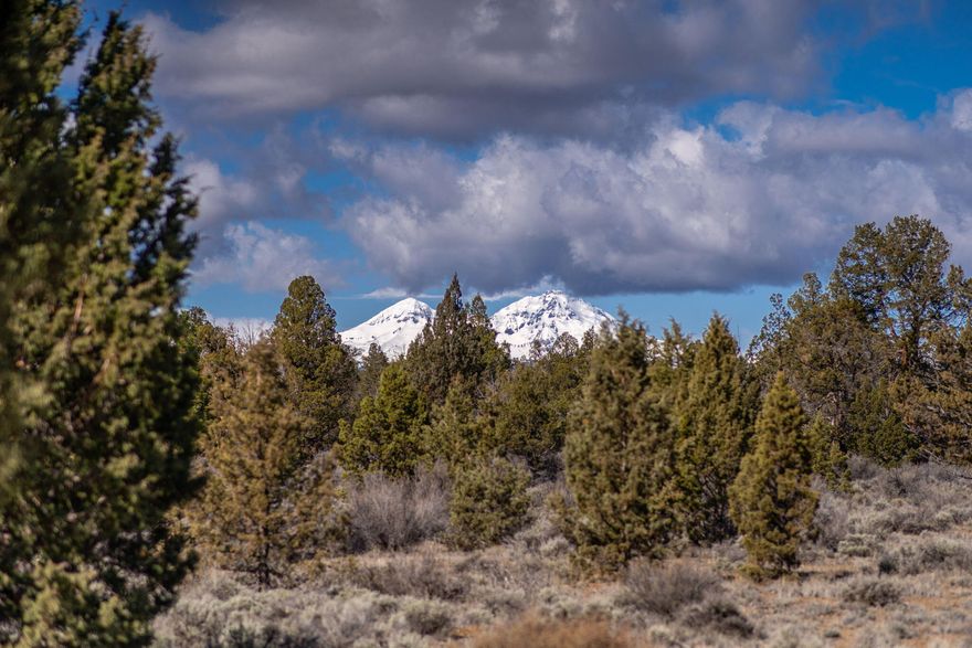 Escape to Central Oregon with this stunning 40-acre property, offering breathtaking Cascade Mountain views. Surrounded by privacy and bordering thousands of acres of BLM public land, it's an outdoor enthusiast's dream. Perfectly situated between Sisters, Bend, and Redmond, you can ski, fish, or simply soak in the tranquility of your surroundings. The property features a well-maintained 2 bedroom, 1 bathroom 1995 manufactured home, ideal for weekend getaways or a comfortable living space while you plan your dream home. Enjoy the best of nature with all the conveniences close by. This is your chance to own a piece of Central Oregon's beauty.