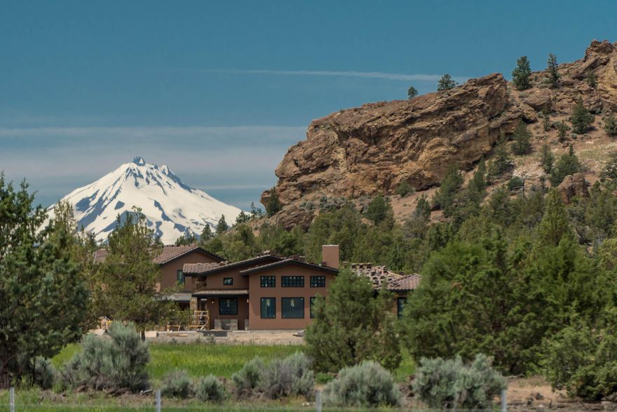 Welcome to Lone Pointe. Unrivaled in its beauty and tranquility located at the base of coyote Butte behind the gates of the pristine Ranch at the Canyons. Surround
yourself with the towering walls of Smith Rock the winding Crooked River and the vast fields and Vineyard. 3140 Single story home with additional 1,132 sqft guest suite
and bonus area above the large 3 car garage. The main bedroom and bathroom feature heated floors, walk in shower and stunning barn wood tongue and groove ceiling.
Home also features 2 additional en-suites, wet bar, slab granite counter tops. Additional distinctive attributes of the 11.28 acre landholding include an open breezeway
overlooking one of the infamous ponds at the Ranch and incredible outdoor living with propane firepit, hot tub and built in BBQ all looking toward Monkey Face.