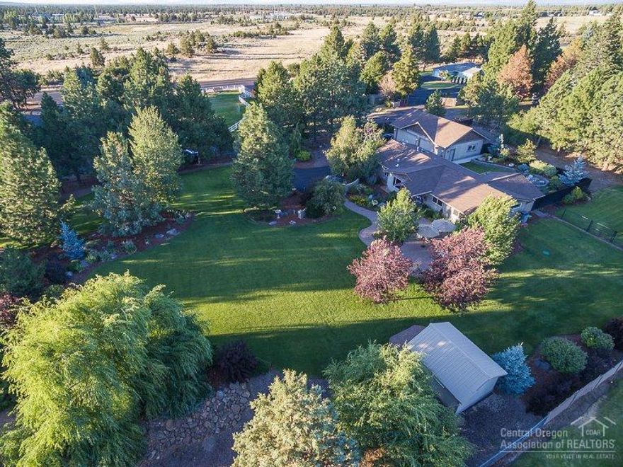 A special one-of-a-kind property on 1.19 acres! Remodeled down to the studs in 2009/10, this home is immaculate & offers clean lines w/contemporary style. Travertine, Caribbean Walnut flooring, horizontal-grain Beech cabinets, SS appliances, gas fireplace, open great room design, plus a 1,161 SF detached 4-car garage! This amazing private setting is gated w/a walled courtyard entrance. Spacious paver patio in front/back, RV parking & storage shed. This park-like oasis is ready for a new owner to love!