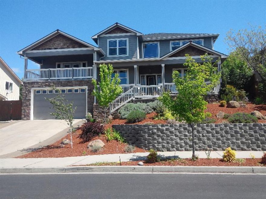 Beautiful home with amazing valley & mountain views - 3213 sq/ft home with fabulous floor plan! 3 bedrooms plus an office & 2.5 bathrooms. Formal living room with gas fireplace, formal dining room, breakfast nook, spacious kitchen with granite counter tops, stainless steel appliances and huge island/bar. Large family room with French doors to deck with beautiful views. Spacious master bedroom features a spa like bath with jetted tub, double vanity, granite counter tops, tiled step-in shower & nice walk-in closet. Crown moldings, some with concealed lighting, upgraded moldings around doorways and bases. Very well maintained, new carpets just installed. Lots of extra storage. Workshop area in garage. Nice covered patio with water feature. The rear yard backs up to an open treed hillside with oaks & the front of the home has breathtaking views of the valley, west hills and Table Rocks. Located in a quiet neighborhood close to Eagle Point Golf Course. This is an amazing value!