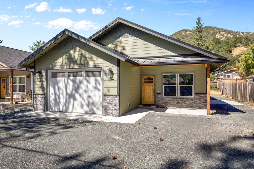 Charming and modern brand new home in Gold Hill! This cozy yet contemporary home features neutral colors, an open floor plan, laminate hardwood floors, custom cabinets with granite countertops, and a farmhouse sink. The kitchen includes a gas stove with both gas and electric hookups for all appliances. Bathrooms showcase upgraded tile and heaters, while the finished insulated garage and large 8x6x40 attic storage space provide plenty of extra room. A 50-year snap-lock metal roof, upgraded HVAC with air exchanger, and a low-maintenance backyard make this home truly move-in ready!