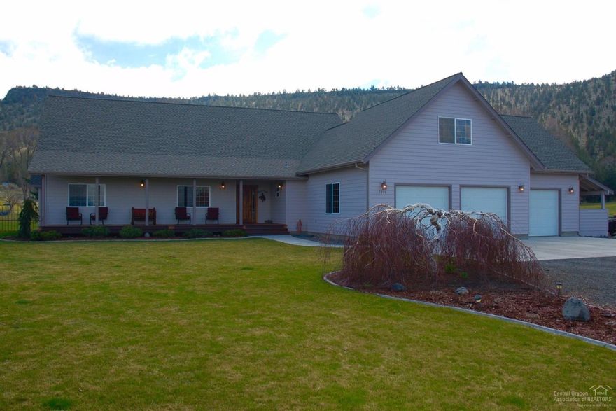 Beautiful custom home on almost 3 acres with 2.6 acres of irrigation right on the Prineville Golf Course. Home features Amish hand scribed wood floors through most of the main living space, a custom hickory front door, lofted family room and bonus room on the upper level and the master on the main level. Pristine landscaping with underground sprinklers, a gazebo/pergola and triple car garage and plenty of room for all your toys or RV.