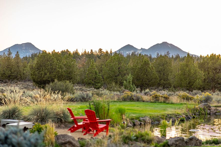 Panoramic Cascade Mountain views, 66.92 acres between Sisters and Bend, and Direct access to thousands of acres of Public Lands create a lifestyle few can claim. 3,056 SF log home features vaulted ceilings, 2 ensuites (incl. main level), lofted bedroom, office/flex, sauna, wine fridge, butler pantry, wet bar, and mudroom. Luxury kitchen w/ concrete counters & high-end appliances. Outbuildings include: a legal ADU above a 2-car garage with a kitchenette, full bath, and 2 king-size built-in beds; detached 3-bay garage plus 2-bay shop with oversized doors; RV parking pad; covered carport pad; loafing shed; horse stall and tool shed. Enjoy the wildlife pond, water feature, outdoor kitchen, pergola, fire pits & multiple seating areas. Gated and paved circular driveway. Whether envisioned as a family compound, equestrian retreat, or legacy investment, this property delivers privacy, flexibility, and prestige — all within minutes of Central Oregon's world-class recreation, culture, and charm