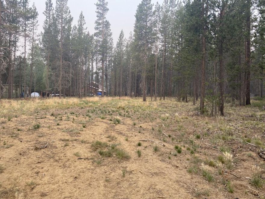HAVE YOU BEEN LOOKING FOR A 1.10 ACRE FLAT BUILDABLE LOT WITH MATURE PONDEROSA PINE TREES JUST MINUTES AWAY FROM SUNRIVER, MT BACHELOR AND THE HIGH CASCADE LAKES. THIS LOT HAS BEEN SEPTIC APPROVED FOR A 4 BEDROOM HOME AND HAS A CLEARED BUILDING AREA. ENGINEERED PLANS COME WITH THE SALE. THERE IS PLENTY OF ROOM TO BUILD A SHOP AS WELL. THE BIG DESCHUTED RIVER ACCESS IS LESS THAT A MILE AWAY. COME SEE WHAT THIS PROPERTY AND LOCATION HAS TO OFFER.
