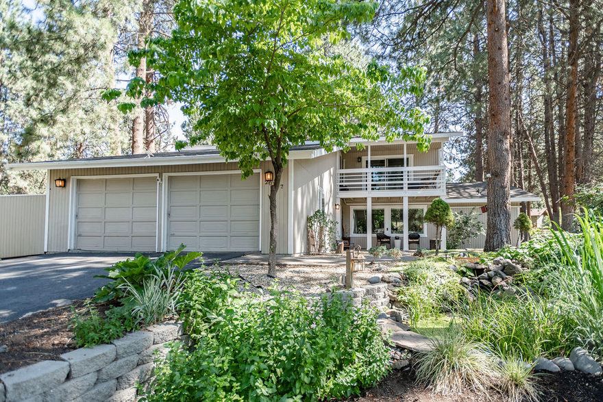 Quiet, park-like setting with established pines surrounding this beautiful home. Enjoy a tranquil backyard from the covered porch or spend evenings in peace and quiet from the upper sitting deck off of the bonus room. Primary bedroom on the main features French doors opening up to the surrounding nature. With 3 bedrooms up stairs and a bonus room, this home provides ample space. This home is located in the Timber Ridge neighborhood, adjacent to Bend Golf & Country Club in SE Bend. HOA covers yard care and watering.