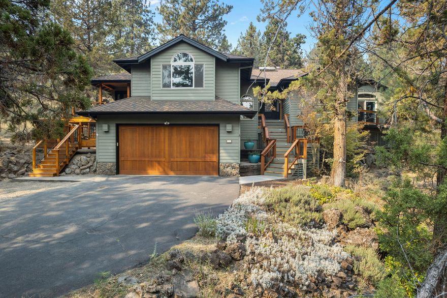 Enjoy private access to the Deschutes River and scenic trails in the Rimrock West neighborhood w/ this stunning home on over half an acre. This single-level gem features an open floor plan w/ large windows, high ceilings, spacious living room w/ wood stove insert and the well-appointed kitchen is equipped w/ high-end stainless appliances and leathered granite countertops. Step outside to enjoy the generous deck complete w/ newer hot tub perfect for relaxation and entertaining. The primary suite serves as a private retreat, featuring a tiled bathroom and a large walk-in closet. The ensuite includes a full bath & laundry leading to a 350 sqft bonus room w/ a gas fireplace. This versatile space has its own private entrance and French doors that open to a charming wrap-around deck—ideal for generational living, ADU or home office. Includes additional detached 2-car garage for ample storage for all your needs. Embrace the tranquility of this property while located close to all things Bend.
