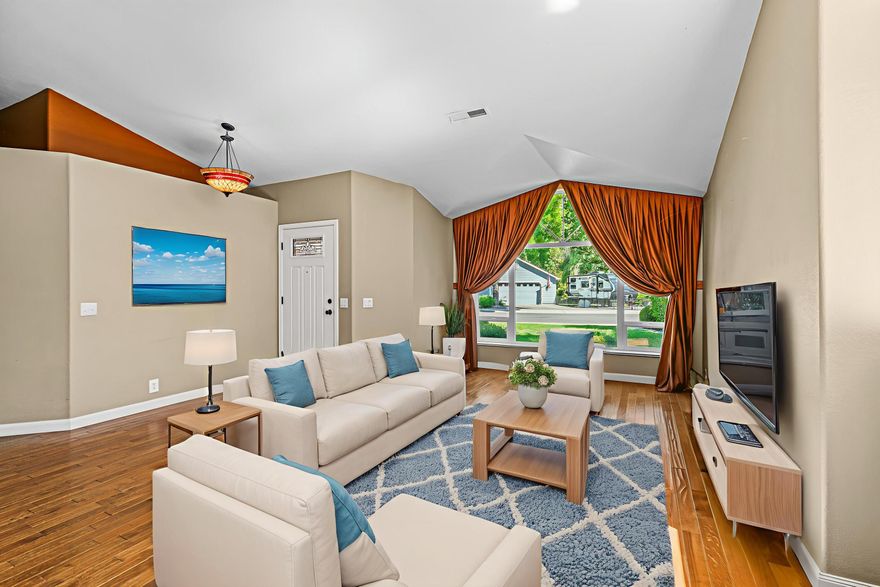 Peaceful and private home in a quiet Lone Pine neighborhood! On a calm street with virtually no through-traffic and a spacious floor plan, this home is a tranquil escape. Vaulted ceilings and floor-to-ceiling pictures windows and transom windows immerse the living room in natural light, with a peninsula fireplace to set a cozy mood in the living room and dining room. The kitchen boasts ample storage, a gas range, and a free-flowing layout open to the breakfast nook and dining room showing off the unique architectural highlights. The primary bedroom features more vaulted ceilings, a generous ensuite bathroom with a soaking tub, and private access to the covered back patio. Well established, low maintenance landscaping and mature trees provide ample shade and create a sense of solitude, plus small RV parking and a sizable storage shed along the side of the house.