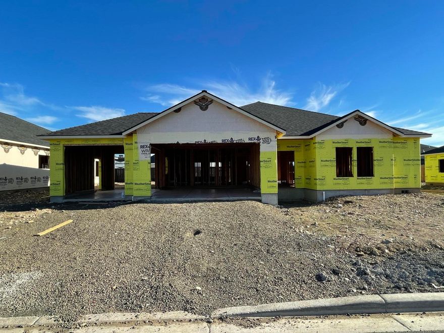 Estimated to be completed late January 2022. Quality craftsmanship and attention to detail with modern finishes throughout this beautiful 3Bed 2.5 Bath Kammerzell built home. The large entry opens to a spacious open floor plan, accompanied with laminate flooring throughout and 
 Black Anderson windows. The Kitchen features include a center island and stone countertops, a full-sized farm front kitchen sink, gas range/oven combo with vented hood, a dishwasher and pantry. The master bedroom presents dual walk in closets, double vanity, tile shower, free-standing soaker tub & much more! The finished 3 car garage is wired for an electric car charging port and Solar ready. Front & back yards are landscaped with grass & bark. HOA Dues are $78/Qtr. **Rendering is for house style and colors only. It does not represent how the landscaping will look**