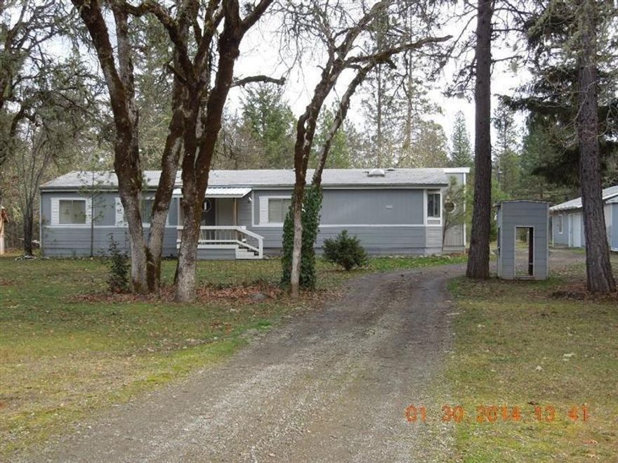 River Front! Home needs a little TLC, there is an awesome shop, cute guest quarters and lots of room for your animals. One car garage is attached to the guest quarters. Just a little fixing could make this a wonderful home.