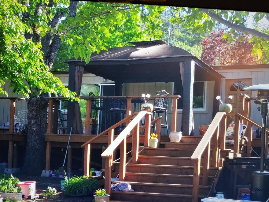 Here is you chance to enjoy the country life while being just minutes from town.  This two bedroom two bath manufactured home with sits on just over four beautiful acres with great views of the mountains from the back deck. A high producing well, room for animals, farming and gardening.  Endless possibilities. Make an appointment to see.