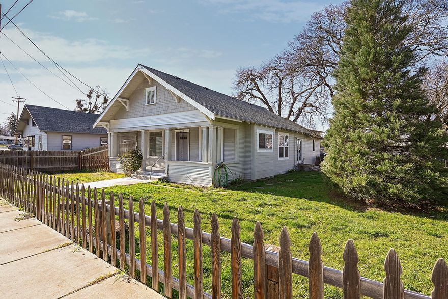 This charming craftsman-style residence, originally built in 1920, exudes character and warmth while boasting modern amenities. Step inside to discover a spacious open-concept layout. A large kitchen, extra bath and laundry room added in 2002 enhance functionality and convenience. Enjoy year-round comfort with central A/C and heat, along with double-pane windows offering energy efficiency and tranquility, Relax and unwind on the inviting porch, or explore the expansive yard that wraps around the home, offering endless opportunities for outdoor enjoyment and relaxation. The potential to add an ADU per the City of Phoenix  presents excellent opportunity for additional living space or an rental income (buyer to do their own due diligence) Don't miss this opportunity to own a piece of history in a fantastic location. Whether seeking a cherished residence or an investment property, this offers the perfect blend of vintage charm and modern comfort. Schedule your showing today!