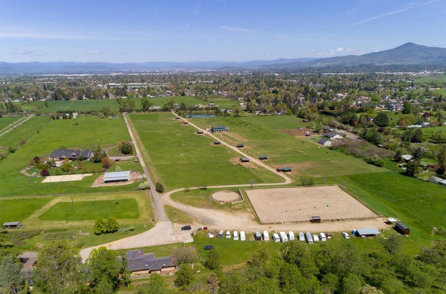 Exceptional setting for you & your horses plus have the option to continue a profitable boarding business! Over 44 acres w/approx. 32 acres irrigated - MID & TID irrigation & underground lines. Main home overlooks picturesque pastures & mountain views. Large picture windows & woodstove in living room. Kitchen has eating bars, stainless steel appliances including gas range/oven, microwave hood & dishwasher. Formal dining room w/French doors to patio. Built-in wardrobes & storage in bdrms. Dble sink vanity in master bath. Laundry room w/cabinet storage & sink. 2 car garage connected w/covered breezeway. 1 bdrm/1bath, 795 sq. ft. guest quarters. Detached shop w/garage. 4 bay equipment shed & 3 bay machine shed. Large round pen & huge outdoor arena. 3,172 sq. ft. barn w/paddocks built in 2011. Tack room, stables & personal lockers. Several pasture shelters. Fenced & cross-fenced. On-site riding trails. Large pond. Beautiful views from all areas of this horse haven property!
