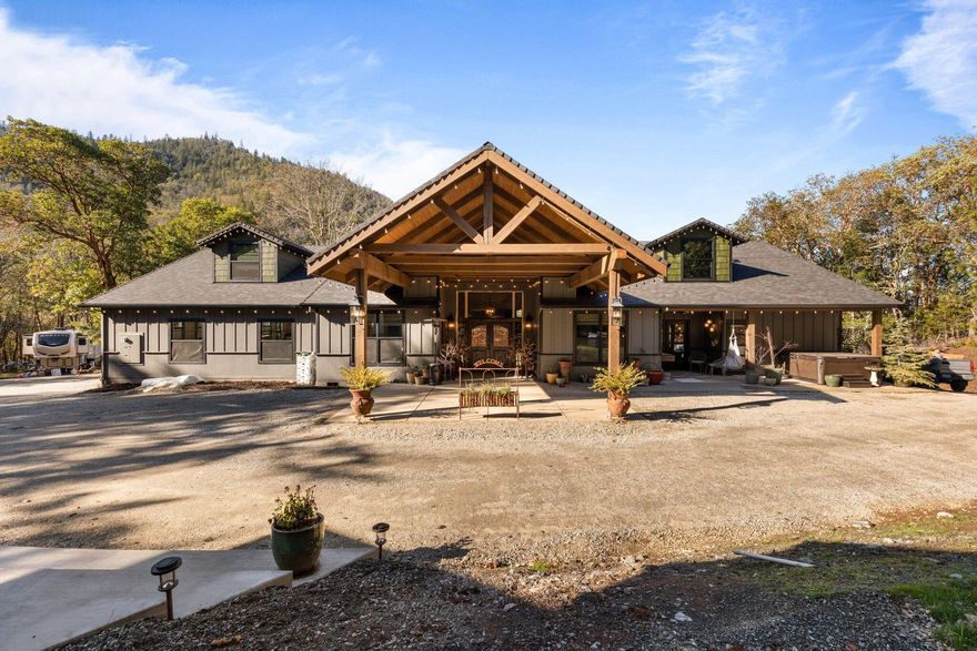 2022 Completely Custom Built*Builders Personal Home*Built with Pride by Lori Magel Homes*Over 2700sqft 1- level+approx 650SqFt Apt w/sep private entrance*Modern Rustic Craftsman style home like you've never seen before. Private & peaceful yet minutes to town. Incredible quality throughout, w/meticulous custom crafted design. Grand entrance w/Hickory HW floors throughout. Gourmet kitchen, top of the line SS appliances, custom knotty Alder cabinets, quartzite countertops, LED lighting, & custom tile walls. Inviting, & comfortable living room w/vaulted ceilings, rustic stone walls. Lg picture windows & xt lg slider to deck. Master suite is elegant & cozy w/cust LED fireplace, vaulted ceiling, & oversized slider to deck with beautiful windows to take in views of the wooded property. Sep dbl vanities, huge dual-head tile shower w/6 body jets, heated tile floors. Outdoor kitchen w/stone seating, fireplace, custom lighting, & remote screen. Oversz 1024sqft garage, +800sqft insul shop +more.