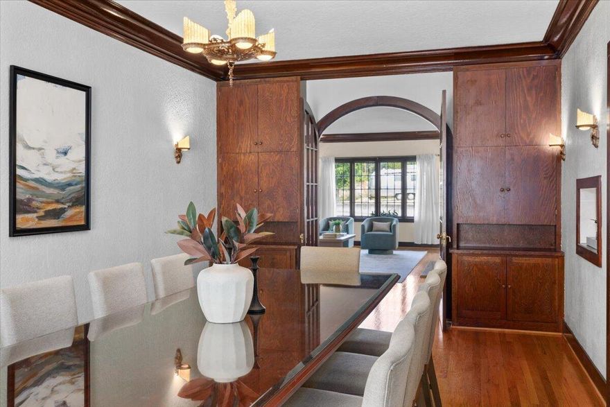 A living piece of Grants Pass history. Extraordinary 4-bedroom, 3.5-bath home—once the long-time residence and in-home medical office of Dr. Ogle, one of the city's first physicians. Originally built in 1928 and restored in 2002, this residence blends historic charm with modern livability. Every corner of this home is rich with preserved character: green-cased light shades, slag glass sconces and chandelier, a rare Art Deco folded-glass ceiling light, and a hand-carved wood stairwell. You'll also find built-ins, leaded glass cabinets in the library, cedar-lined closets, and an operable dumbwaiter. The 330 sq ft finished space in the basement served as Dr. Ogle's original in-home office, offering a uniquely historic setting for a studio, guest suite, or workspace. The charm continues in the garden with an original outdoor fireplace, a serenity pond, lush gardens, extensive period brickwork, and wrought iron gazebo all beautifully preserved. Own a true Grants Pass landmark.