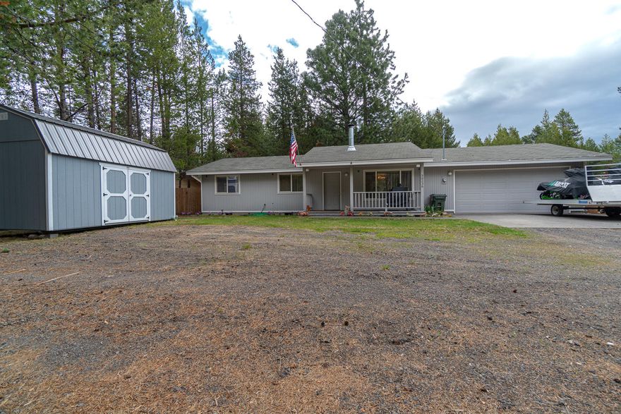 Situated in the mature pines on the edge of OWW, minutes from world class fly fishing, hiking, Mt Bachelor & the high lakes. This community has Deschutes River access & is the heart of Central Oregon recreation. This turn key home is ready to go, situated on a quiet paved street w/mature pines & low maintenance landscape. Covered front porch leads to a wood floor entryway & great room layout w/ large windows bringing in an abundance of natural light. Main living area features a wood burning stove w/ tiled base that opens to the kitchen. Three bedrooms & two full baths as well as laundry room that leads to a small back patio area and a fully fenced backyard. Property has two sheds for storage, chicken coop & pen, in ground fire pit with natural wood benches/seating, as well as garden beds for planting! Don't miss!