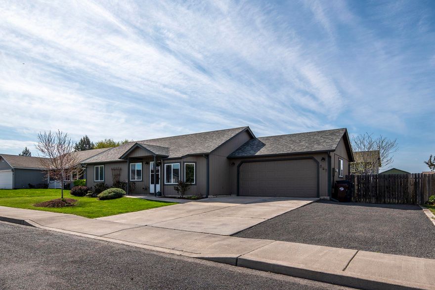 Pride of ownership is evident in this single story home on a large lot with sought after RV parking. Beautifully updated kitchen with refreshed cabinets, counters, stainless appliances and lighting upgrades. Real hardwood flooring in the living room, kitchen and hallway. Additional interior features include LED lighting throughout, updated bathrooms and new carpet in the bedrooms. The home has all new interior and exterior paint including the doors. The spacious fenced and landscaped back yard features a huge covered concrete patio ideal for entertaining. In addition to the back lawn, there are mature trees for privacy, fruit producing trees (e.g. apples, pears and blueberries) and a dedicated garden space with raised beds, a drip system and numerous perennial plants. Continuing, there are also gutters, outdoor speakers, a storage shed and hot tub hook-up. Home is located in a quiet NW Redmond area close to schools, Quince Park and shopping.