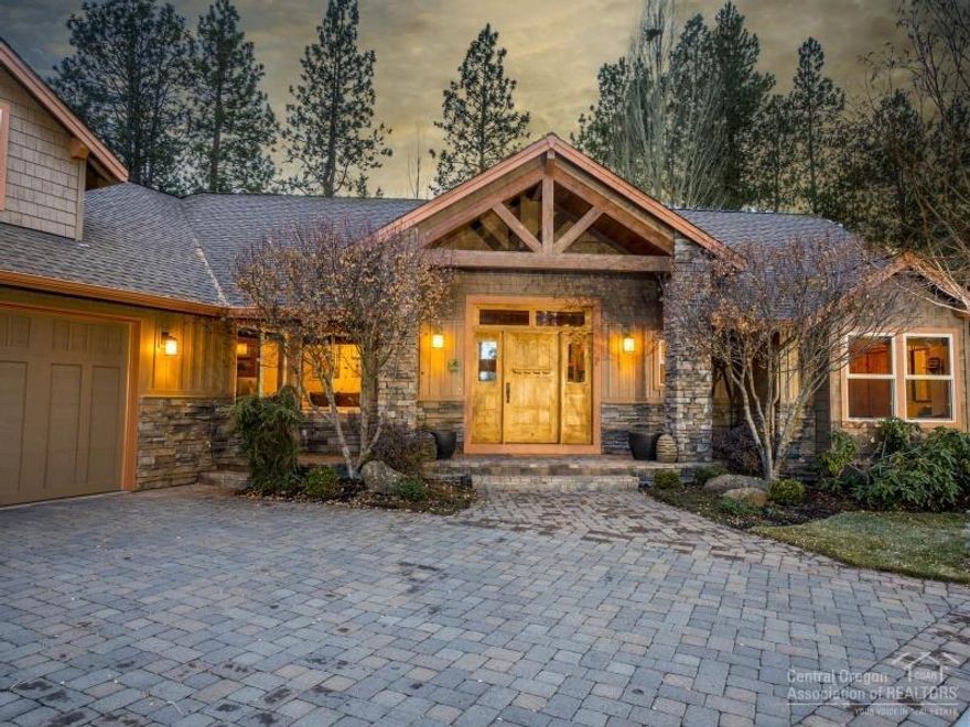 Exceptional property in the gated section of River Rim, built by Schumacher & remodeled by Neil Kelly! This quality home features soaring ceilings & walls of windows in the great room - fabulous ambient light with a great connection to the beautifully landscaped yard, made for both entertaining and cozy family moments.The master & guest rooms are on the main level with great separation & a large bonus room is upstairs. 3 car garage & ample storage, plus access to river trails out your backdoor!