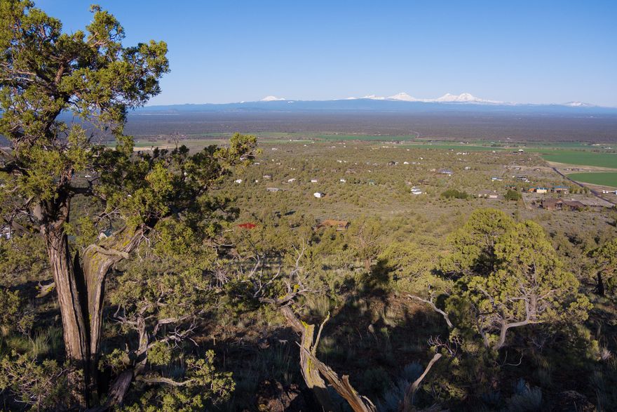 Panoramic Unobstructed Cascade Mountain & Smith Rock views greet you from this 6.8acre buildable lot located on the western slope of Powell Butte. The lot is 15 minutes from Redmond, 20 minutes from Bend, and 20 minutes from Prineville. To the south you can see the Paulina Buttes and China Hat. Every cascade peak from Mt Bachelor on north to Mt Hood are completely visible from the homesite. A domestic well is needed but power is nearby at the adjacent lot with a transformer in place. The paved road leading to the property becomes gravel about 200 feet from the property boundary, so a fully paved road is possible without much extra expense. Click the virtual media link for aerial footage with a guided on the ground walkthrough of the building site and parcel.