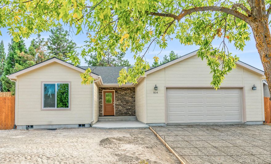 Introducing a remarkable new construction by Kuhlman Builders! This property features a 3-bedroom, 2-bath layout with 1,950 sq. ft. The open floor plan with vaulted ceilings creates a comfortable living space, while the kitchen boasts stainless steel appliances and granite countertops throughout. The living and dining areas provide ample room for entertaining. The split floor plan ensures privacy, with the primary bedroom offering a tiled shower, walk-in closet, and lots of natural light. Outside, a large back patio for relaxation. This home also features, instant hot water, a 95% efficient gas furnace and backflow system installed and is wired for sprinklers. This home the perfect blend of comfort, style and functionality. Quiet, private and well maintained neighborhood with additional parking area provided and 2 community common park areas. Don't miss the chance to own this incredible new construction.