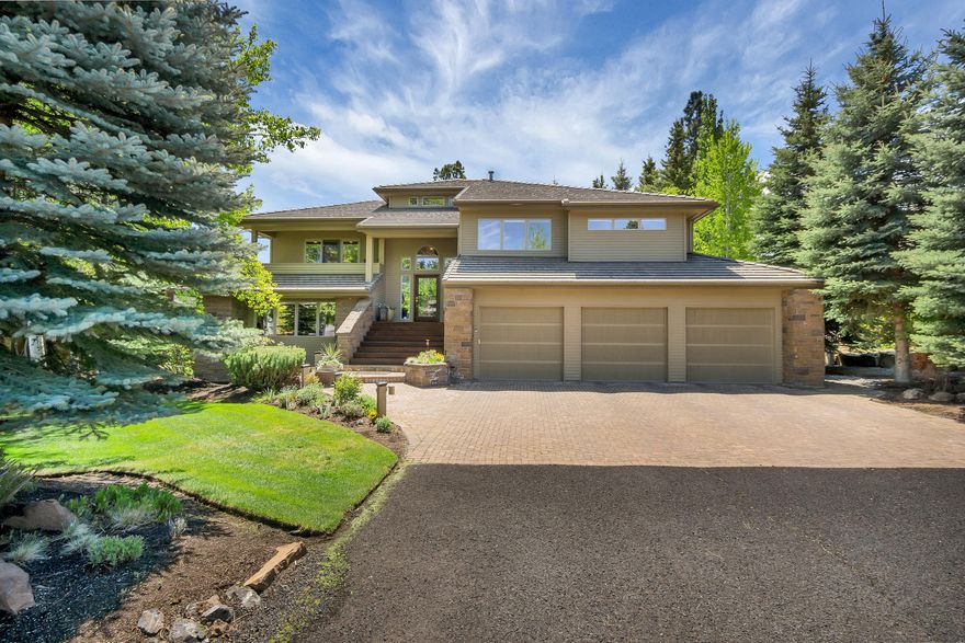 Beautiful home located in the prestigious Broken Top Golf Course community. Throw the doors open and invite everyone inas thisstunning home as room for all! A grand entry awaits a roomy yet comfy living space with views of the second green. Let the sunshine in with the south facing windowed walls allowing the light and warmth to fill each room. The wonderful reverse-living floor plan offers ease and flow of indoor/outdoor entertaining including a spacious kitchen with a huge island and it's own private patio. This 5 bedroom with main level master suite, fireplace and huge closet also includes 2 en-suite bedrooms downstairs. A fabulous wrap around upper south facing deck over looks your private backyard as well as the green. 3-car garage plus additional storage.