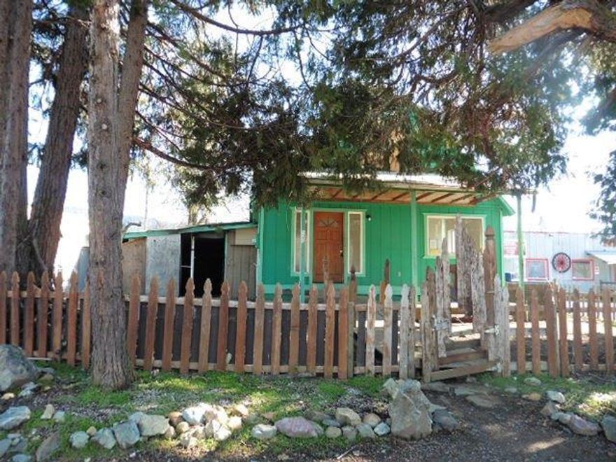 Lots of potential with this 3 bedroom 1.5 bath home in the heart of Cave Junction. Conveniently located close to services. Fenced backyard and offers exterior storage. Step inside to a large living room and kitchen. Priced to sell.