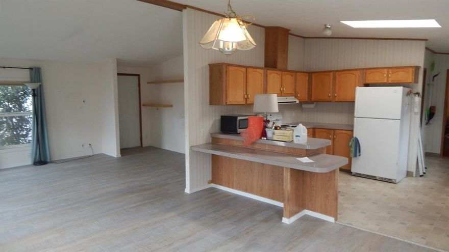 Affordable Ashland anomaly and forward thinking investment. Vacant and ready to go! R-3 lot. Build units now or in the future or use an a rental/get into your first property in Ashland. 2 Bedrooms and 2 baths, 1132 Sq Ft. 1993 manufactured home on large .22 of an acre. Wide plank engineered wood flooring, skylight, open floor plan, foundation, $23,000 investment in solar panels, 2 ductless heat pumps, heated floor in Master bath, comfortable home as is. City has said that with the removal of the home, 3 units may be built on the site. Check with City planner. Single garage, Back porch, garden shed, fruit trees, Located on Flag lot. Open House Friday, May 3, 11-1 pm.