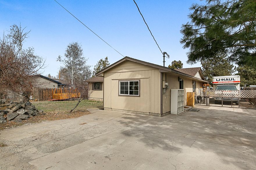 Looking for space & flexibility? Don't miss this one! Single level home in convenient SW Redmond, just minutes to Hwy 97, airport & amenities. 3 bedrooms, 2 full baths, mudroom & a den/4th bedroom w/tons of built in features. Spacious living room w/T&G blue pine walls, cozy gas burning fireplace & laminate flooring. Dining area off of the galley style kitchen. Hickory cabinets, full set of appliances & plenty of counter space. Mud room features a washer & dryer, tons of storage space & additional access to outside. Primary bedroom easily accommodates a King sized bed set & more, w/attached bath & step in shower. Efficient solar tube in the living room, sky light in the guest bath & plenty of windows. Sliding door in living area opens to a spacious deck & huge back yard. 2 car + shop is situated behind the home & has add'l covered storage. RV parking available on both sides of the home. Roof is 3 years old & landscaping is ready for your personal touch. Call today - don't miss!