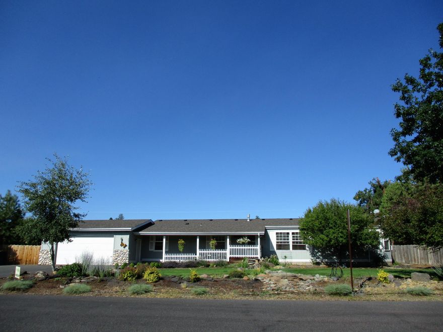 Buy This Home For All The Right Reasons! Mountain views to be had from this 1,782 sq.ft. home. Single level, 4-bedroom house on just shy of 1/2 acre inside the Sisters city limits. Room to park all of your toys, and add an ADU. Or take a big step and split the lot for 2-homes and 2-ADUs. No CC&R's. This 1994 manufactured home is complete with a vaulted ceiling, separate family room, spacious master bedroom, oversized double garage and covered front porch. The backyard is fenced with landscaping, additional graveled parking, deck and patio: the perfect spot to sit and watch the sun set over the Three Sisters Mountains.