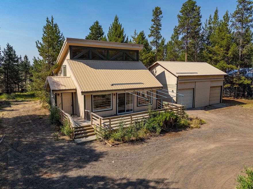 Are you looking for that cute cabin in the woods? This is it! A sweet galley kitchen, bedroom on the main with a nice sized loft, lots of windows, a large detached heated shop/garage and a large shed for storing all of your toys. Just off of the paved road with a nice sized horse property behind it, gives you a great feeling of outdoor life, especially with the beautiful pine trees on this property. You are a few blocks from the neighborhood country store with many items you need without having to go the extra few miles into town. You are close to Central Oregon's outdoor wonderland for all of the adventurous and minutes from downtown for all of your other needs. Don't miss out on your opportunity.