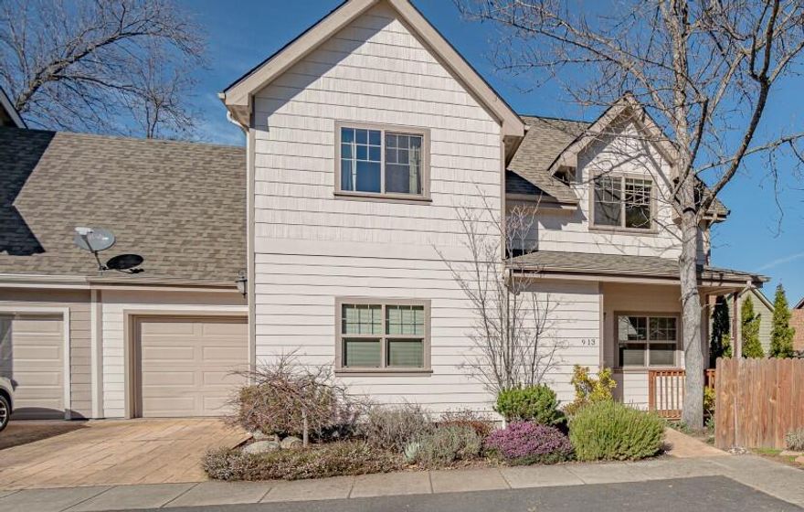 Charming Ashland townhome with easy access to shopping, schools, I-5 and bus lines. This 2012 two-story includes a thoughtful floor plan, large living room with tasteful wainscoting and mini-split heat and air, powder room, and a tidy kitchen with granite countertops, loads of cherry cabinets, stainless appliances, gas range, and roomy dining area. Upstairs has a nice primary bedroom with vaulted ceilings, good-sized full bath and mountain views, and two separate guest bedrooms with walk-in closets and shared guest bath. Sit and relax on the covered front patio or enjoy the flagstone patio and mature plantings in the fenced backyard. There is a good-sized laundry/mudroom, attached single-car garage, gas central heat with air conditioning, gas water heater and best of all, ZERO homeowner's fees! This property is ideal for owner-occupied living, investment, off-campus housing for SOU, and is ready for immediate occupancy! Don't Miss It!