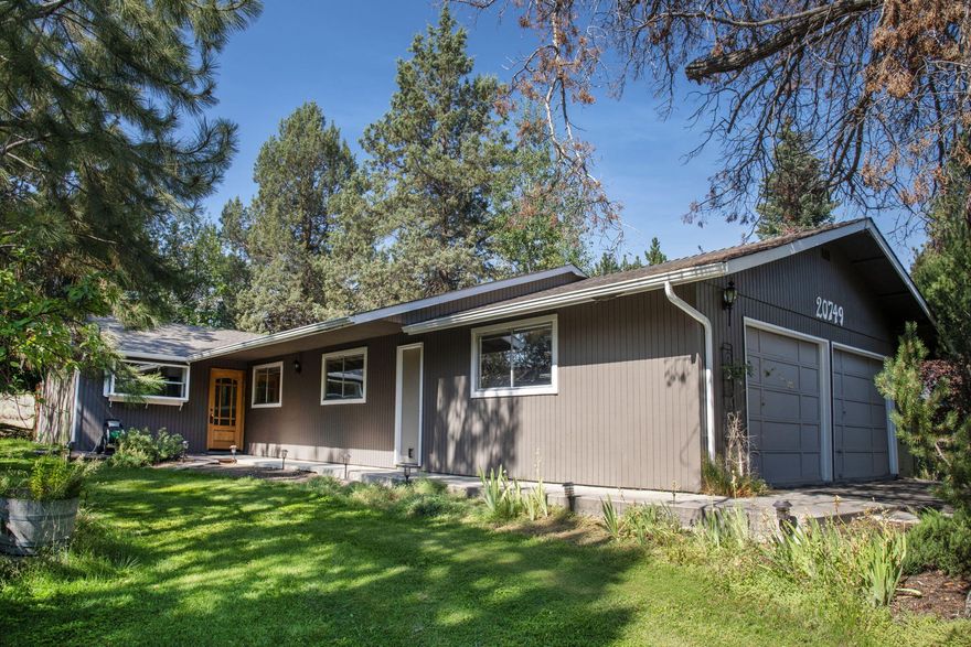 A wonderful single-level, 4-bedroom, 2 bath home in Nottingham Square. Offering a serene, park-like environment with access to over 20 acres common area throughout the neighborhood. The updated kitchen boasts custom cabinets, soft closing draws/doors, quartz countertops, farmhouse style sink, large garden window, refrigerator & double oven range. The newer engineered hardwood flooring flows into the living room which offers an abundance of windows, gas fireplace, tile surround, built in shelves and raised hearth. A good-sized primary bedroom with a tiled bathroom and updated vanity. 2 car garage w/workbench, built in cabinets & shelving. Situated on a 0.18-acre lot complemented by mature trees and shrubs this property offers proximity to both a canal and scenic trails. Located near the 37-acre Alpenglow Park and exciting new Reed South Plaza, which include locals favorite Cascade Lakes Brewing, Reed Crossing Market, Haven Bagel & Coffee, Axel's Taco Shop, The Great Greek and more.