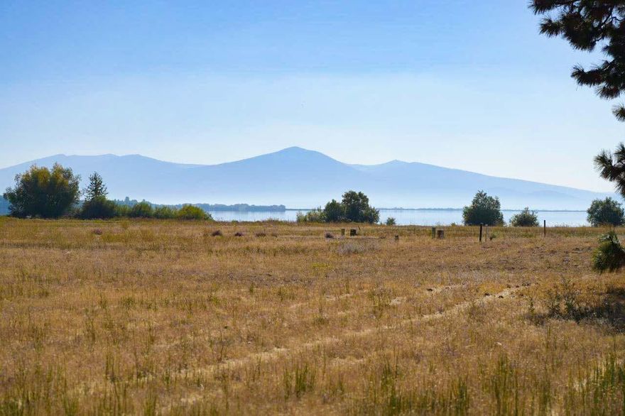 Area of custom homes, underground utilities in, lake and mountain views. Walk to lake and just minutes to Williamson or Wood River trout fishing. Incredible bird life, sunsets and boating. Boat launch right next door! New construction 1,600 sqft minimum. Lot 6-common area.