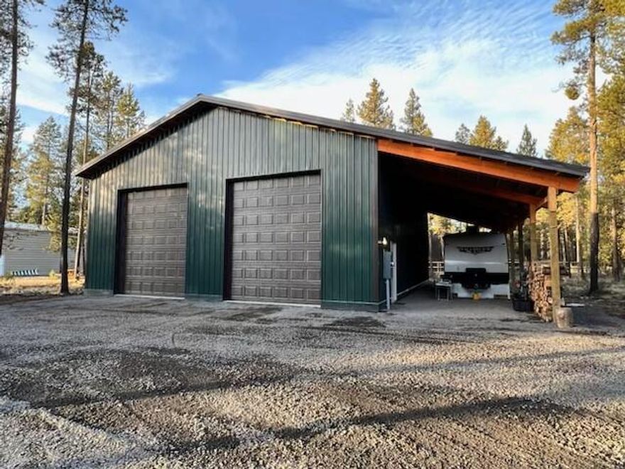 Just completed and ready for you.. Custom built large shop on recreational lot. 40 x 50 with overhang.  Nicely situated on a half-acre lot with nice trees for privacy. The large circle driveway is great for getting your RV in or out as well as all the toys. Oversized 15' overhang also gives plenty of additional space. 200-amp service with several outlet, RV plugs inside and out, and very bright lighting. Location is great and very close to the deeded boat ramp to throw the paddle boards in, or just enjoy the Big Deschutes river. Close to all the lakes, Mt Bachelor, and the amenities of Sunriver.
