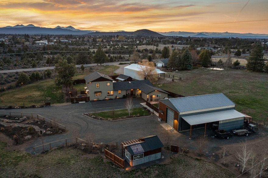 This adorable turn-key acreage property is the one everyone's been waiting for! Located just outside of Bend's UBG, this is a perfect place for those looking to enjoy the country life yet still yearn for urban amenities. Renovated w/ a bright interior design & stunning mountain views from nearly every room, this home offers spacious living & family rooms, plus an additional bonus space. An upstairs primary suite glows w/ natural light & cascade views. A beautiful backyard accented by mountain views, paver patio & adorable she-shed is an ideal place to enjoy summer sunsets. Two well-manicured & irrigated pastures & greenhouse is ideal for your dream hobby farm. A 1500 SF industrial shop awaits complete w/ a 13 ft door & additional covered car port. All of this is just minutes from one of Bend's newest business districts offering vibrant restaurants & retailers including Cascade Lakes Brewing. Come see why this small acreage property is the one you've been waiting for!