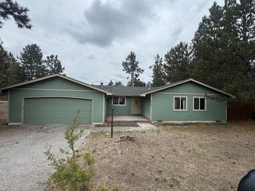 Great opportunity for investor or DIY buyer with this 1520 SF home on a pine treed corner lot in NE Bend. Single level, gas fireplace in living area and wood stove insert in family room. 3 bedrooms, 2 baths, tile kitchen counters and appliances included. The family room slider opens to the large grassy fenced in backyard for your summertime parties. There is plenty of room on this nearly 1/4 acre lot to park your RV and there is an oversized attached two car garage. Convenient location near schools, medical facilities, shopping and restaurants. Make this one your own and update to your liking.