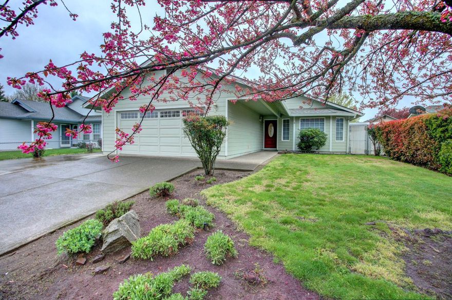 Nicely maintained and comfortable home!  Newer heat pump (2021), roof, and water heater.  Vaulted great room, laminate flooring in the entry, dining room and kitchen.  Ceiling fans in kitchen and all the bedrooms.  Newer vinyl in guest bath. Linen closet in the hall.  Bayed master with large walk-in closet and plant shelving.  Large covered side patio.  EZ care landscaping with graveled areas, stone walkways, stone edging mature plantings & flowering trees, garden beds, and front timed sprinklers.  Finished 2-car garage with opener.  RV parking.