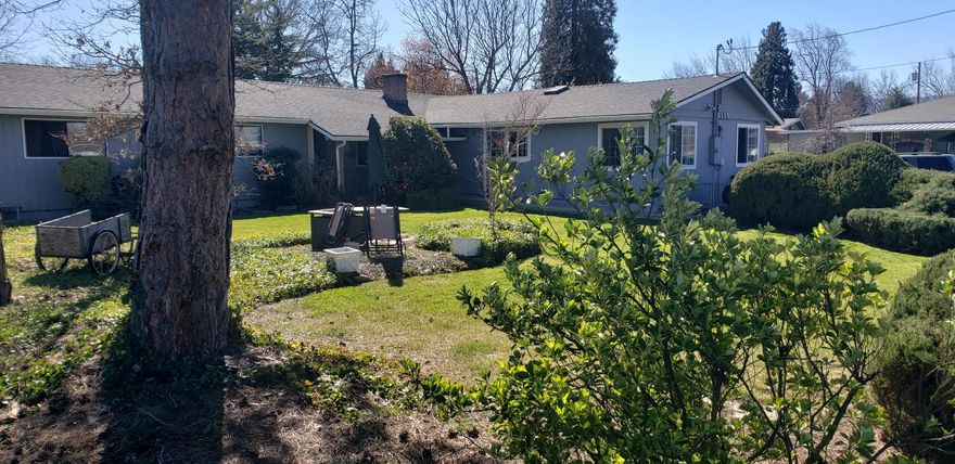 Rare 7 bedroom single story home on a large lot. The main house has 5 bedrooms and 1 and a half baths. Garage has been converted into a permitted separate manages quarters with a living room, 2 bedrooms, a kitchenette and a full bathroom with separate water heater.  Another bedroom, used as an office, has its own entrance. Plenty of room in the back of the property for a shop. Presently occupied as an adult foster care facility. 24 hour notice for showings.