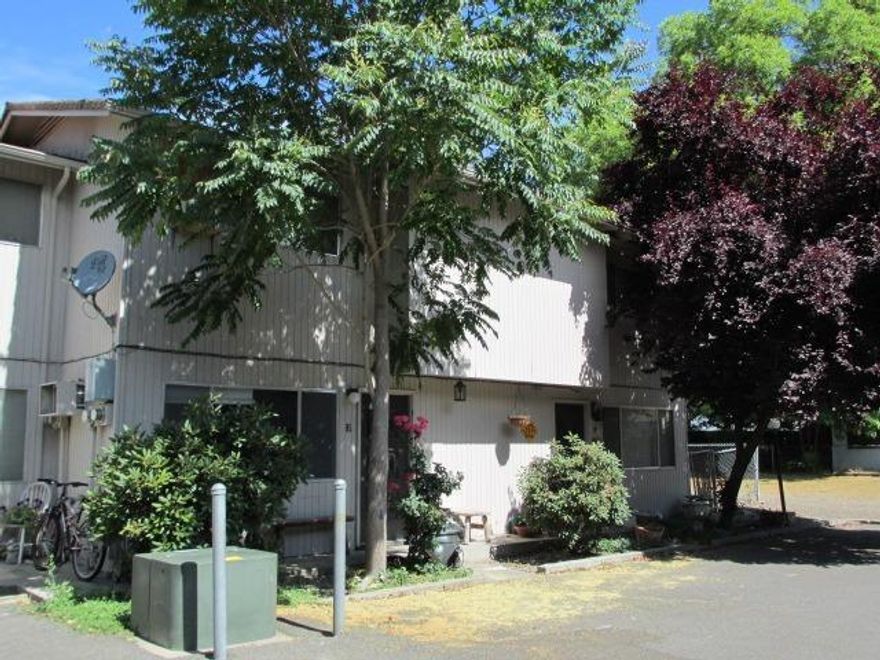 Wonderful investment opportunity in downtown Grants Pass. 15 unit apartment complex on 0.49 acre lot and 2 bedroom, 1 bath home on adjacent 0.17 acre lot with additional parking for tenants. Four units were completely rebuilt and completed in April 2013 due to tenant fire. Buildings were painted in 2013, Trex balconies and stairs rebuilt in 2009. All decks have been replaced as well as the walking bridge.100% occupancy with increasing rents opportunity. Both tax lots to be sold together. Ideal for a 1031 Exchange Property. All information is deemed reliable but not verified; anyone considering purchasing this property should perform their own investigation into the uses and condition of the property.